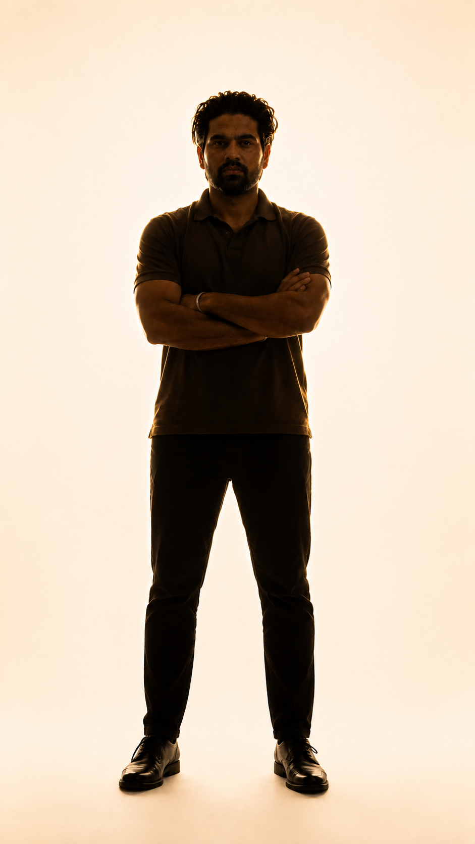 Akshay Raghav standing, backlit portrait