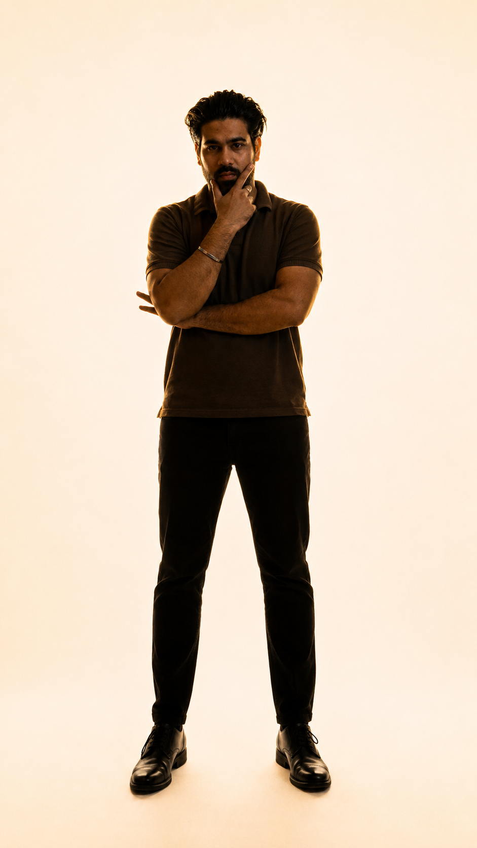 Akshay Raghav in a reflective pose, backlit portrait